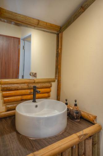 a bathroom with a white sink on a wooden counter at Bamboo Seaview Koh Larn Second Floor - 2nd Floor in Ko Sak