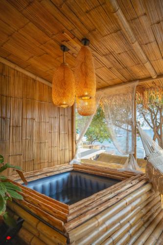 an indoor hot tub in a bamboo house with lights at Bamboo Seaview Koh Larn Second Floor - 2nd Floor in Ko Sak