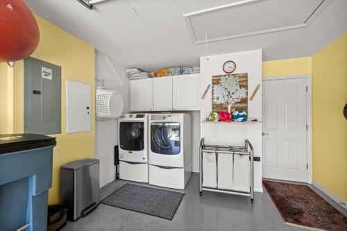 a laundry room with a washer and dryer at Sunnyside Escape in The Villages With Golf Cart & BBQ in The Villages
