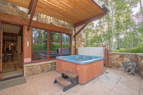 a jacuzzi tub sitting in the middle of a patio at Tramontana 1 - Tramontana Trailhead in Telluride