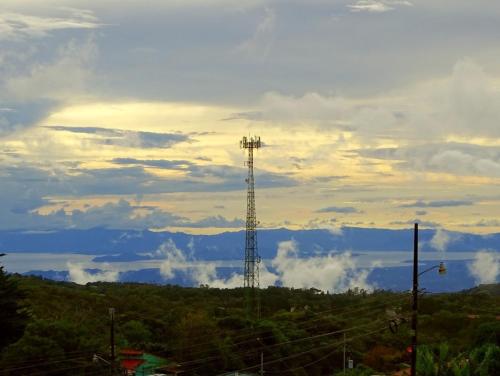 a cell phone tower sitting on top of a hill at Miztli Lodge & Adventure in Monteverde Costa Rica