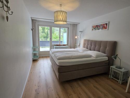 Ένα ή περισσότερα κρεβάτια σε δωμάτιο στο PL203 frisch renovierte lichtdurchflutete Wohnung mit Terrasse