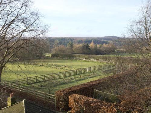 a wooden fence in a field with a field at 4 Bed in Goathland G0042 in Goathland