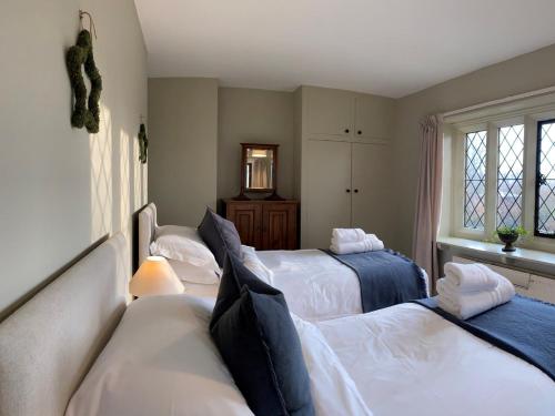a bedroom with three beds and a window at 4 Bed in Goathland G0042 in Goathland