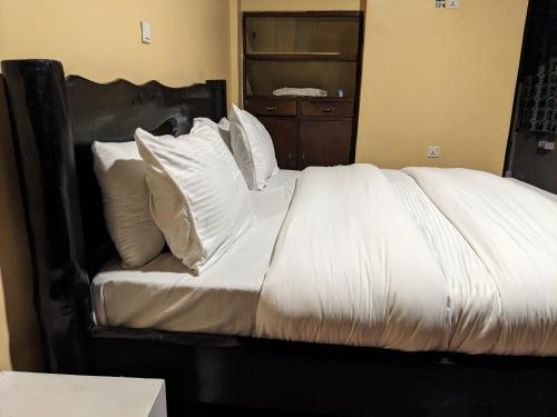 Ένα ή περισσότερα κρεβάτια σε δωμάτιο στο UMUGANO House Inn