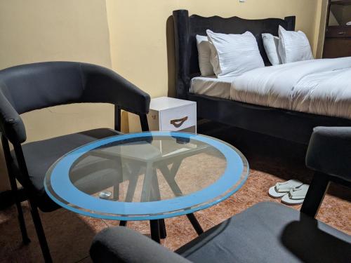 Ένα ή περισσότερα κρεβάτια σε δωμάτιο στο UMUGANO House Inn