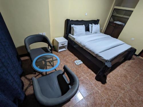 Ένα ή περισσότερα κρεβάτια σε δωμάτιο στο UMUGANO House Inn