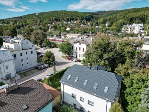 an aerial view of a town with a train at 65m2 Apartment near Vienna - Up to 6 Guests - Self Check-in - Free Parking in Purkersdorf