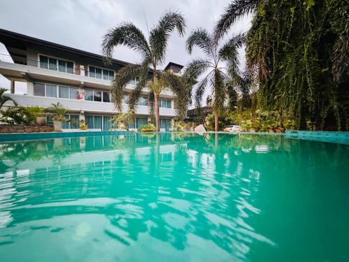an empty swimming pool in front of a hotel at Royal Rock Sigiriya in Sigiriya