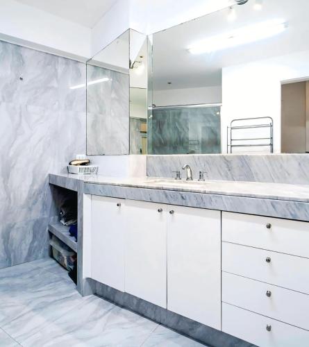 a bathroom with a sink and a mirror at Amazing Luxe Apartament in Medellin in Medellín