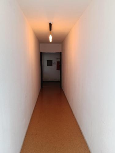 an empty hallway with a light on the ceiling at SOBREIRO - Sobreiro Alojamento - Grijó in Grijó