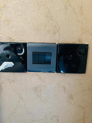 a lightswitch with a face on it on a table at Royal Rock Sigiriya in Sigiriya