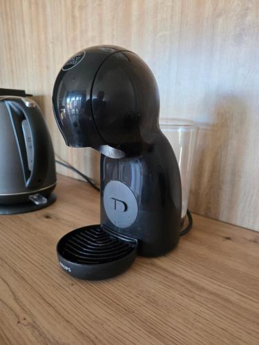 a black mixer sitting on top of a table at Villa 11 Limoni in Sukošan