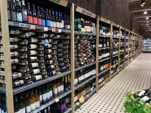 a store aisle filled with lots of bottles of wine at Luxury private property-pool, unique sun roof, free wifi in Budens