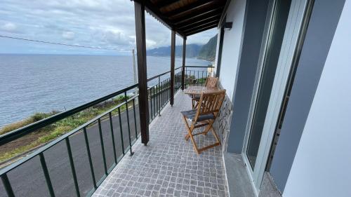 a balcony of a house with a view of the water at Casas das Hortas, Apartamento Vista Mar in Seixal