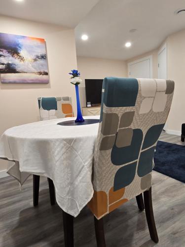 a table in a room with a vase on it at Stormwater Haven in Winnipeg