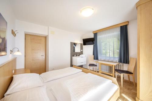 Ένα ή περισσότερα κρεβάτια σε δωμάτιο στο Pivan Apartments