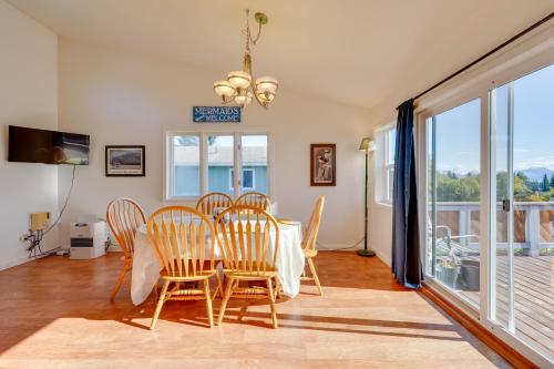 a dining room with a table and chairs at Mountain Views for Miles! Apt Near Homer Spit in Homer