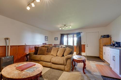 a living room with a couch and a table at Fish and Hike! Home Base for Kachemak Bay Adventures in Homer