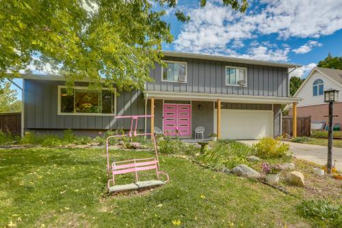 a house with a pink swing in the yard at 12 Mi to Denver Home with Game Room in Wheat Ridge in Wheat Ridge
