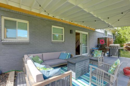 a patio with a couch and a table at 12 Mi to Denver Home with Game Room in Wheat Ridge in Wheat Ridge