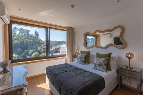 Postel nebo postele na pokoji v ubytování Estrelas do Douro