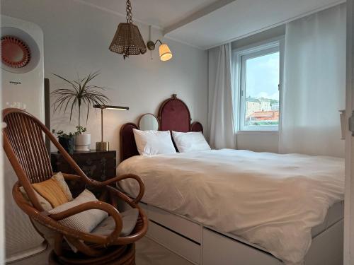 a bedroom with a bed and a chair and a window at Secret Villa Seoul , Korean Traditional and morden mix Design in Seoul