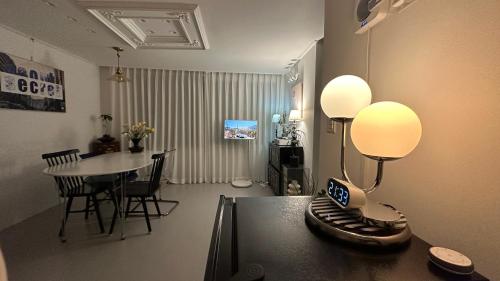 a living room with a table with a lamp on it at Secret Villa Seoul , Korean Traditional and morden mix Design in Seoul