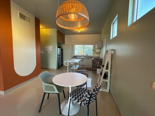 a kitchen and dining room with a table and chairs at Eddys in Chihuahua