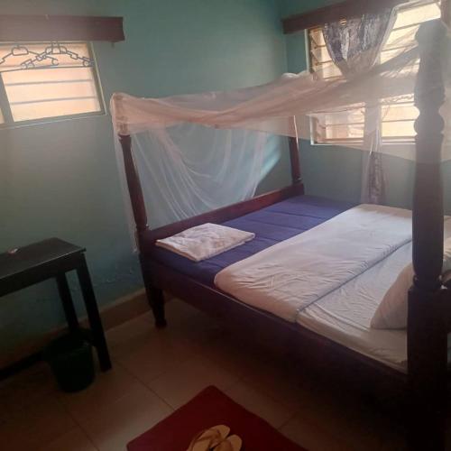 Katil atau katil-katil dalam bilik di Oval Guest House