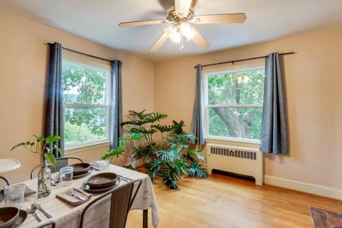 a dining room with a table and two windows at Home 2 Mi to Shenandoah Natl Park and Skyline Drive in Front Royal