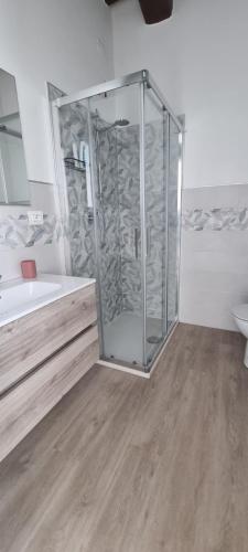 a bathroom with a shower and a tub and a sink at Affittacamere Laura in Orvieto