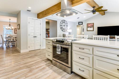 a kitchen with a stove and a dining room at Gorgeous San Marco Home with Patio and Grill! in San Marcos