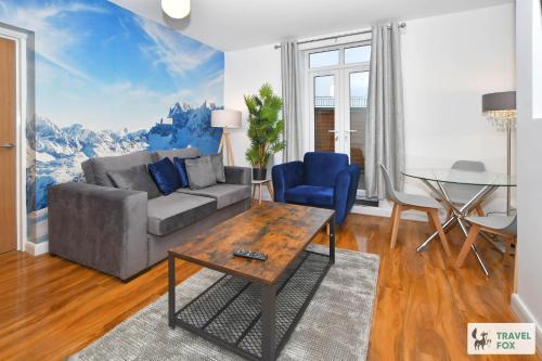 a living room with a couch and a table at 2 Bedroom Central Stay in Stoke on Trent