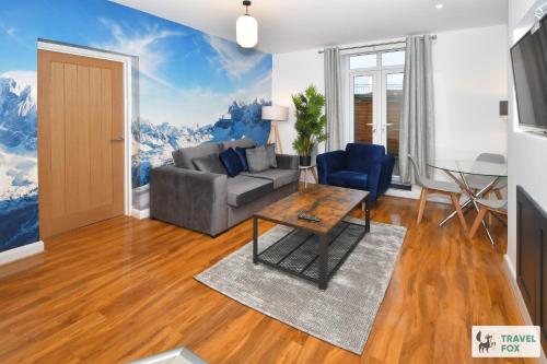 a living room with a couch and a table at 2 Bedroom Central Stay in Stoke on Trent