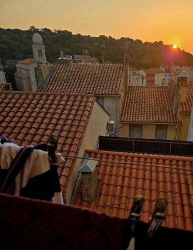 a view of the roofs of a town at sunset at Cosicocoon in Port-Vendres