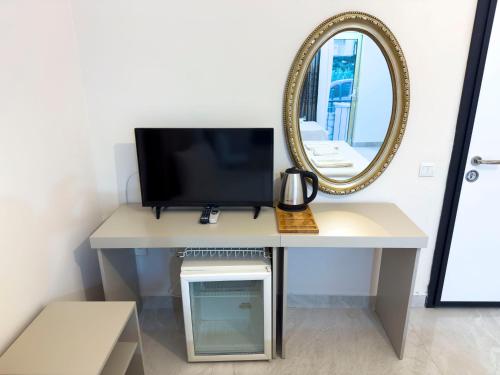 TV a/nebo společenská místnost v ubytování Nava Hotel