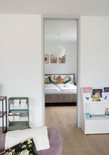 a mirror in a room with a bed and a bedroom at SimpleSparks I Luzern I Andermatt I Natur I Family in Altdorf