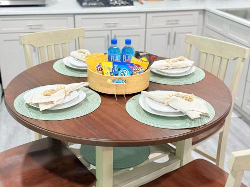 a table with a childs toy and plates and drinks at Dora's Haven Getaway-Cozy 1Bedroom with Boat or Camper Parking- Free in Mount Dora