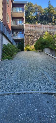 an empty parking lot in front of a building at Casa Gamle Bergen in Bergen