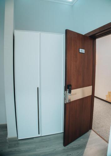 an open door in an office with a phone on it at AS Hotel Ganja in Ganja