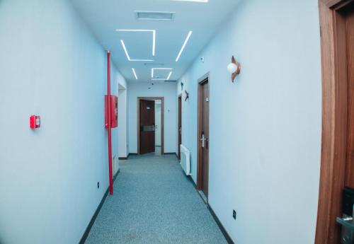 an empty hallway with a ceiling with lights at AS Hotel Ganja in Ganja