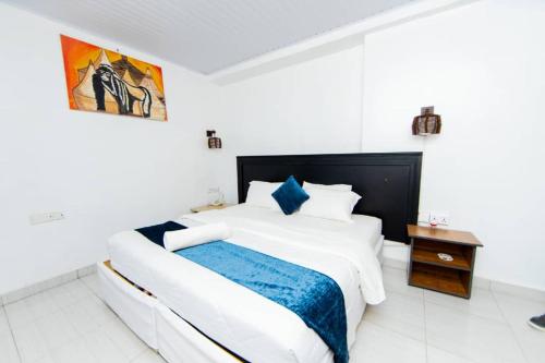 Katil atau katil-katil dalam bilik di INZOZI AFRICA HOUSE B&B-Gishushu