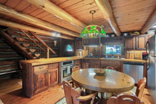 a kitchen with a table and a dining room at The Mule Lodge in Clarion