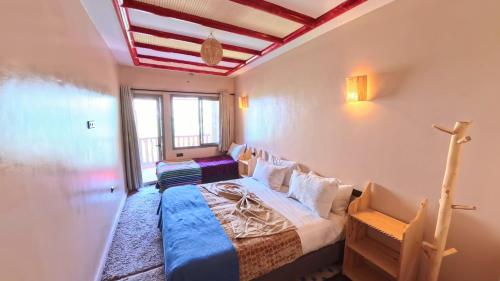 Cama o camas de una habitación en Atlas Berber Lodge
