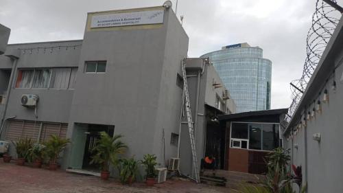 a building with a crane on the side of it at Hotel bougainvillea Victoria island in Lagos
