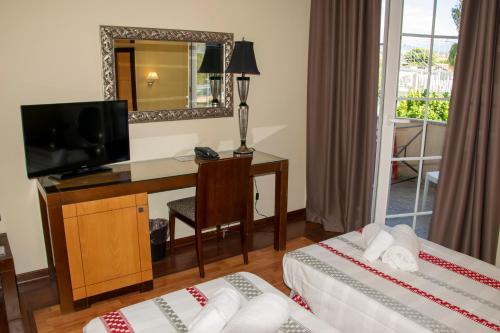 Katil atau katil-katil dalam bilik di Regent Beachotel