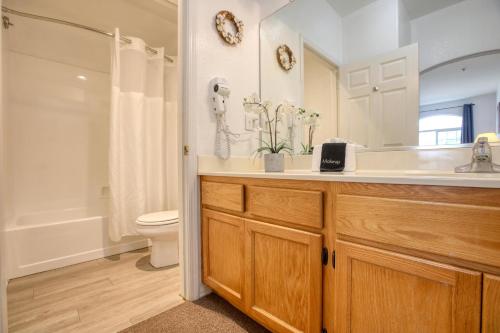 a bathroom with a sink and a toilet and a shower at Pacific Plaza #305 - Shore Thing - BdrmD-K in Oceano
