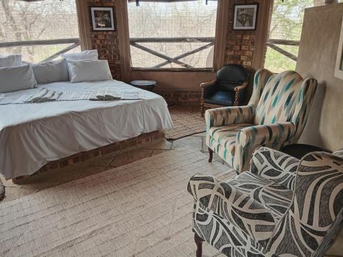 Katil atau katil-katil dalam bilik di Elephant memories safari lodge