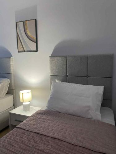 Postel nebo postele na pokoji v ubytování MarSia Apartment